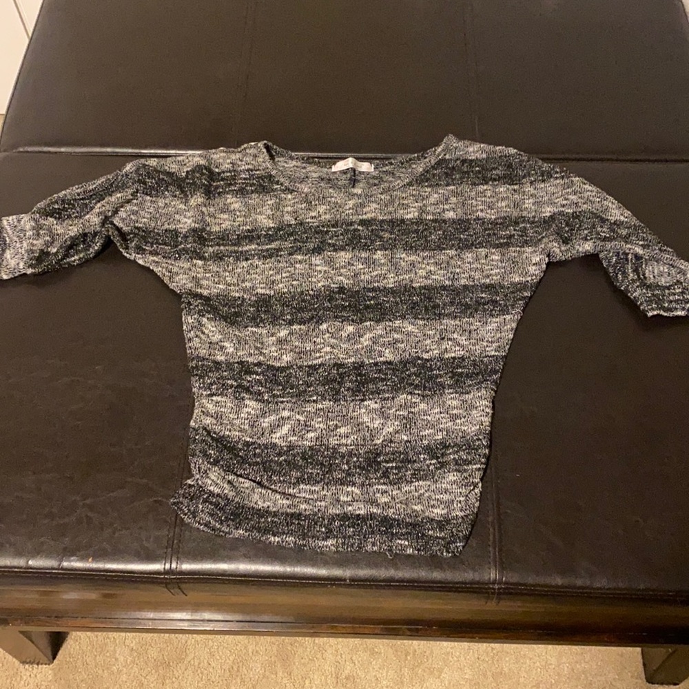 Black and grey sweater.